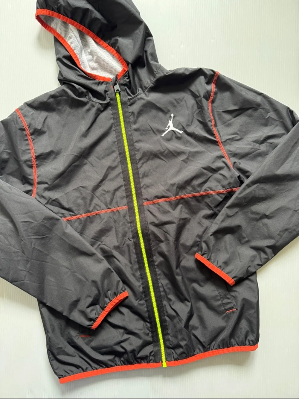 Air Jordan Black, hooded Windbreaker Jacket with Neon Zip. Youth Size XL